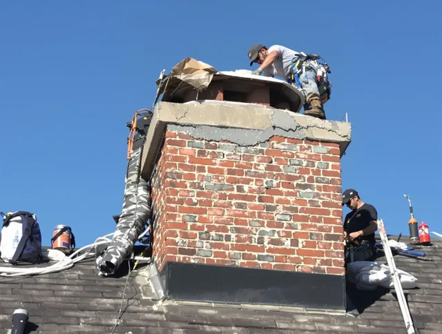 Tampa Chimney Sweep installing a custom chimney crown in Tampa, FL