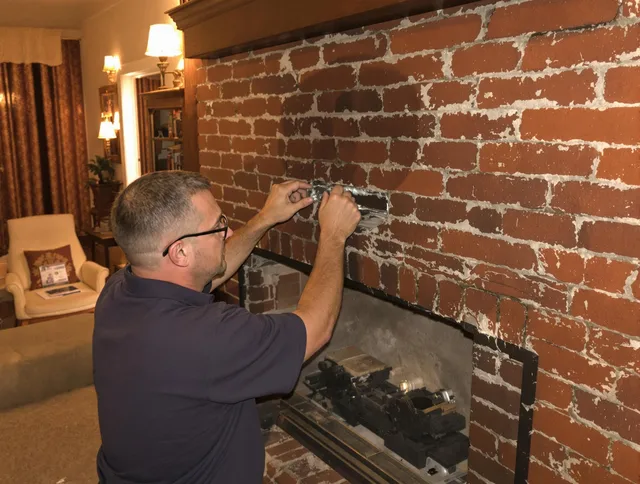 Tampa Chimney Sweep expert fixing a fireplace in Tampa, FL